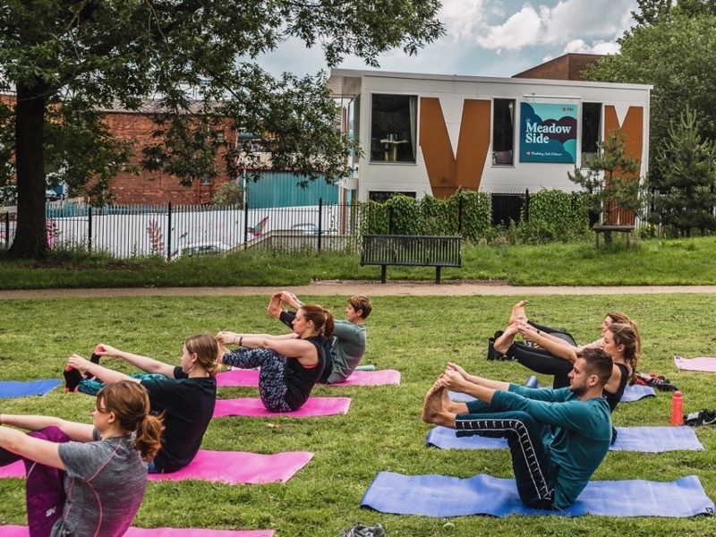 outdoor yoga class at Angel Meadow Park