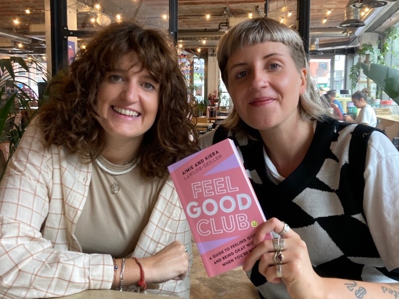 Aimie and Kiera Lawlor-Skillen with their Feel Good Club book