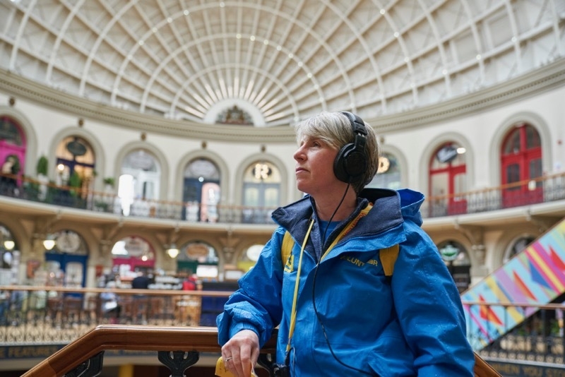 2023 04 13 A Leeds 2023 Volunteer Pauses To Enjoy As You Are In The Corn Exchange Credit Justin Slee 1