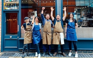 The Team At Another Hand Stand In Front Of New Opening Another Hand Restaurant
