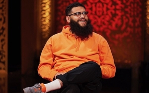 Jamali Maddix In An Orange Jumper Smiling