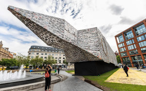Marta Minujin Big Ben Lying Down With Political Books At Piccadilly Gardens In Manchester As Part Of Manchester International Festival