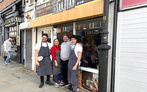 The Sanjuan Family Outside Their Colombian Cafe In Stockport
