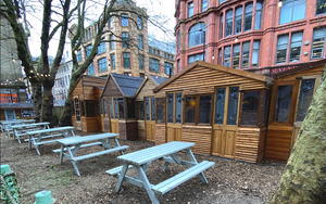 Blue Picnic Benches And Wooden Ski Huts At Mala Secret Beer Garden Northern Qusrter Manchester 1200 800