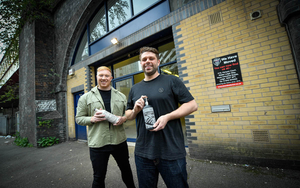 Salford Rum Founders Tommy And James Holding Bottles Of Their Salford Born Rum On Viaduct Street In Manchester