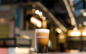 A Pint Of Bundobust Chaitro Against The Backdrop Of The New Brewery