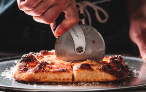 2021 02 24 Header Nells At Home Square Pizza Being Cut By Hand