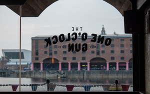 The Front Window Of The One O Clock Gun Pub Situated In Liverpools Royal Albert Dock Next To Maray