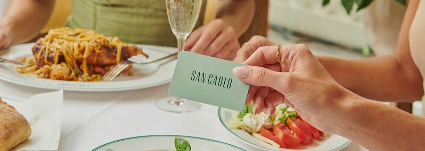 Firefly Gemini Flash A Womans Hand Holds The San Carlo Credit Card Which Is Mint Green In Front Of The 135107